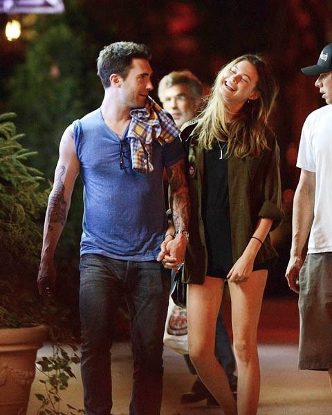 80859, NEW YORK, NEW YORK - Tuesday July 10, 2012. **EXCLUSIVE** SHE WILL BE LOVED! Maroon 5 singer Adam Levine walks hand in hand with new girlfriend model Behati Prinsloo as they walk back to their hotel on a warm night after dining at Blue Ribbon restaurant in the SoHo neighbourhood of New York City. ***FRANCE OUT*** Photograph: © PacificCoastNews.com **FEE MUST BE AGREED PRIOR TO USAGE** **E-TABLET/IPAD & MOBILE PHONE APP PUBLISHING REQUIRES ADDITIONAL FEES** LOS ANGELES OFFICE:+1 310 822 0419 LONDON OFFICE:+44 20 8090 4079